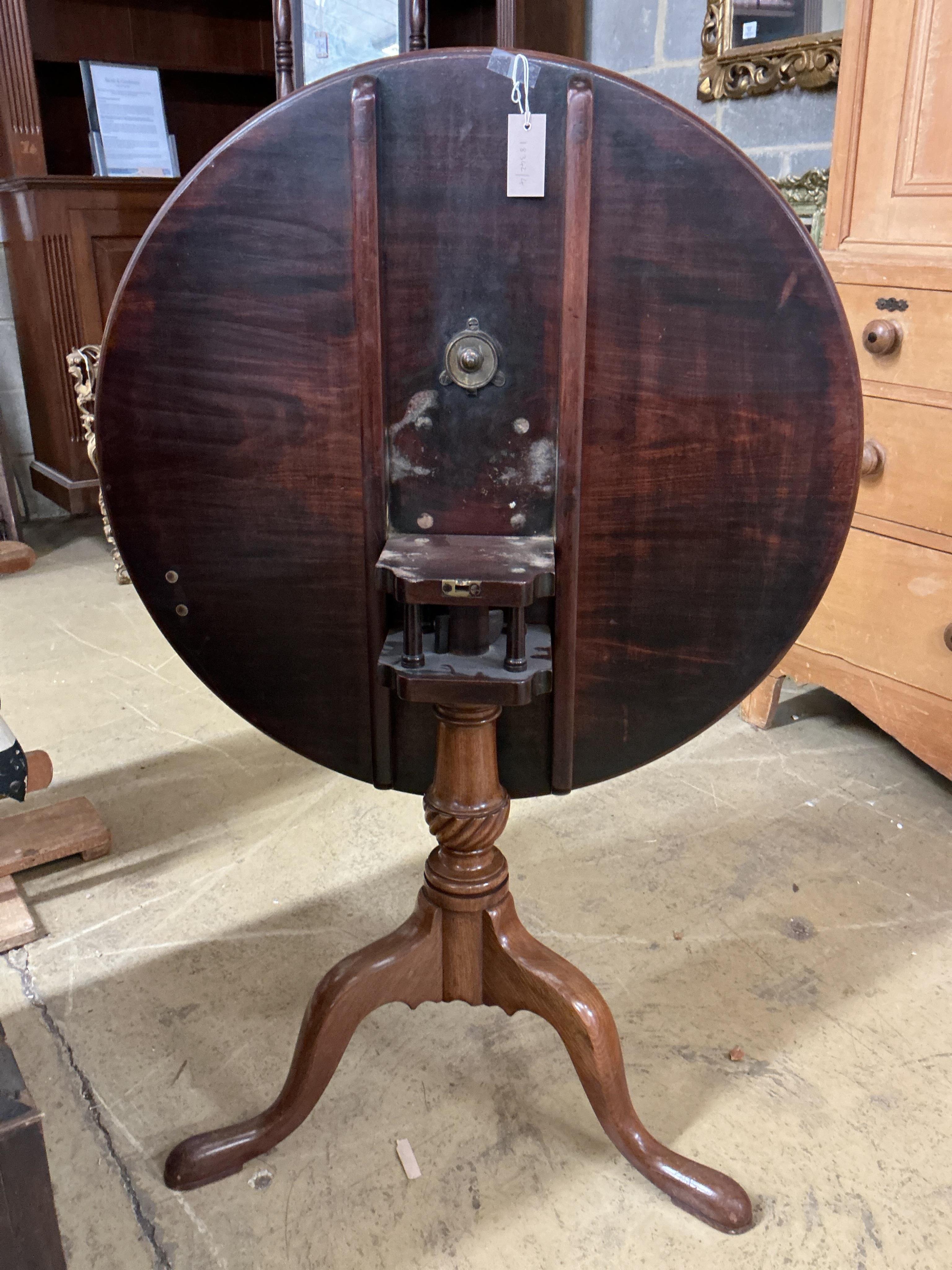 A George III circular mahogany tilt top tripod birdcage tea table, diameter 79cm, height 69cm
